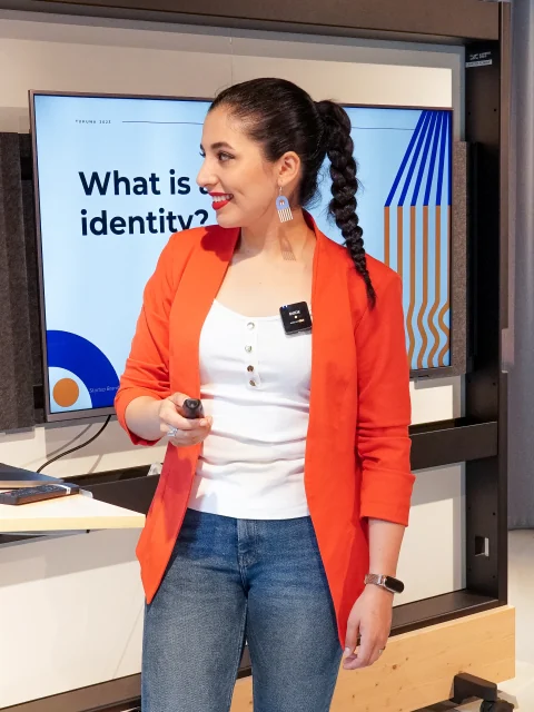 Gaby giving a talk on brand identity